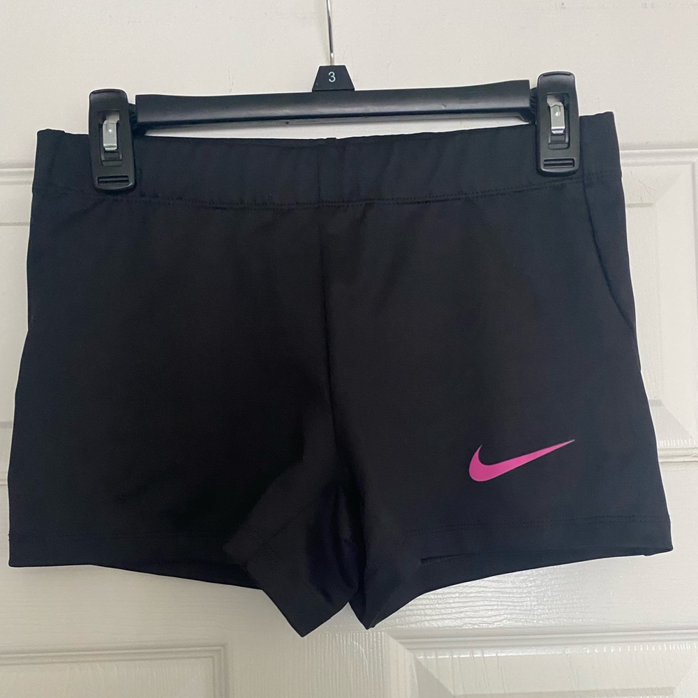 Black Nike shorts with pink Nike symbol